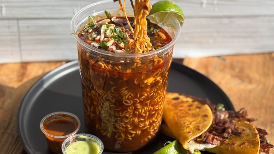 Birria Ramen — noodles in rich birria broth topped with cilantro and lime